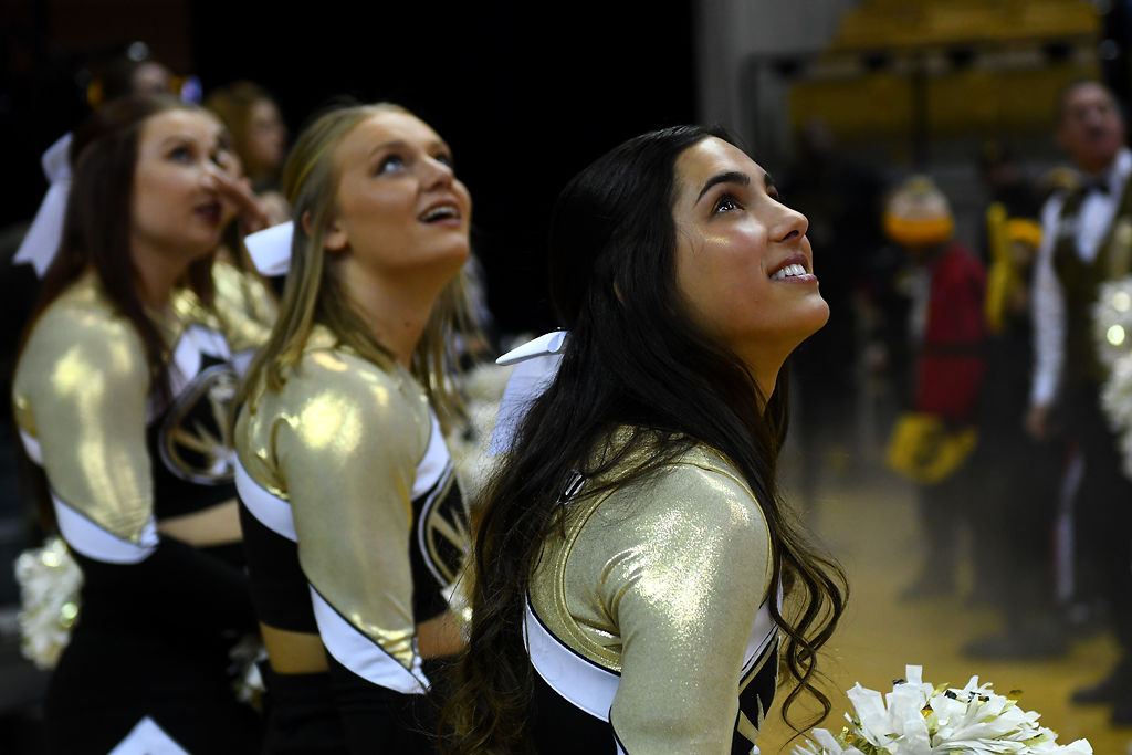 Missouri cheerleaders wait for the men's basketball team to run onto the court